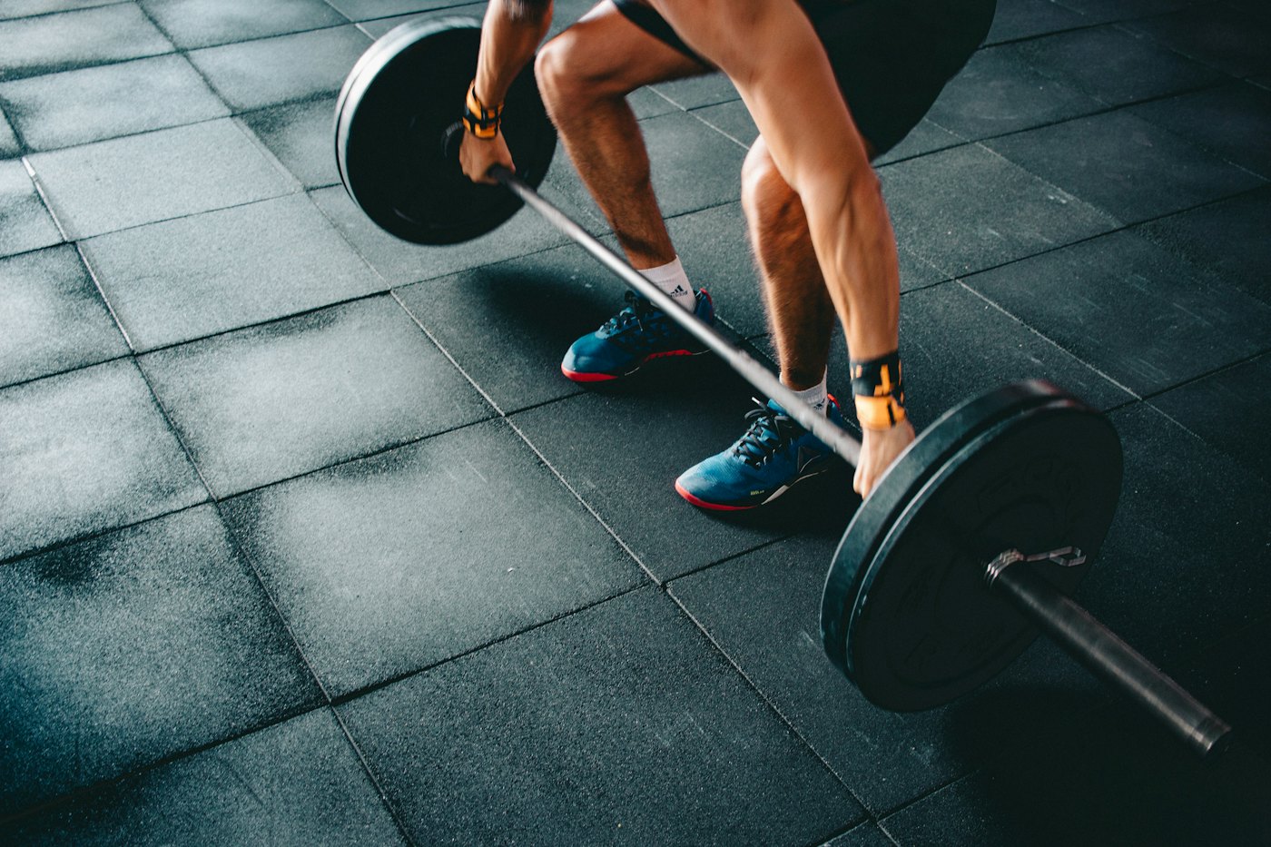 Close view of a deadlift with a loaded barbell