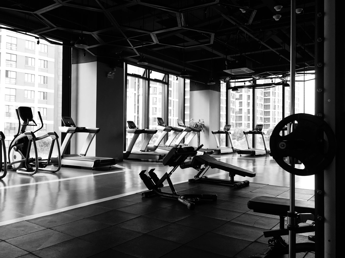 Treadmills and an elliptical trainer in a gym