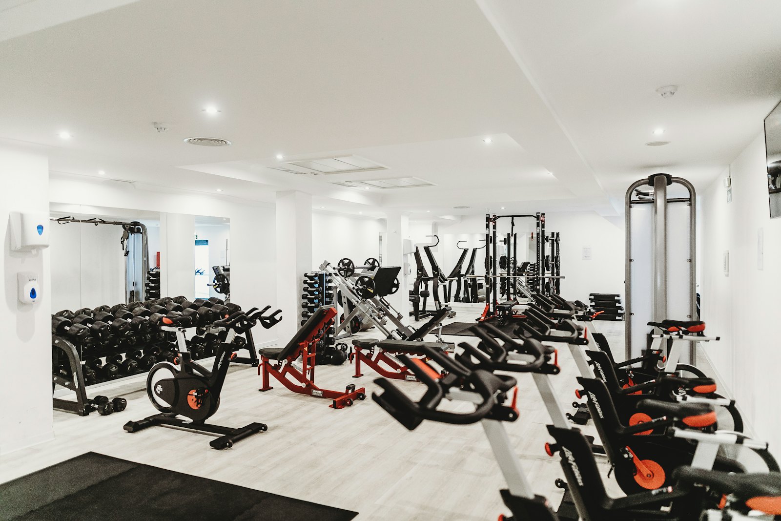 A training floor with bikes, benches and cable equipment