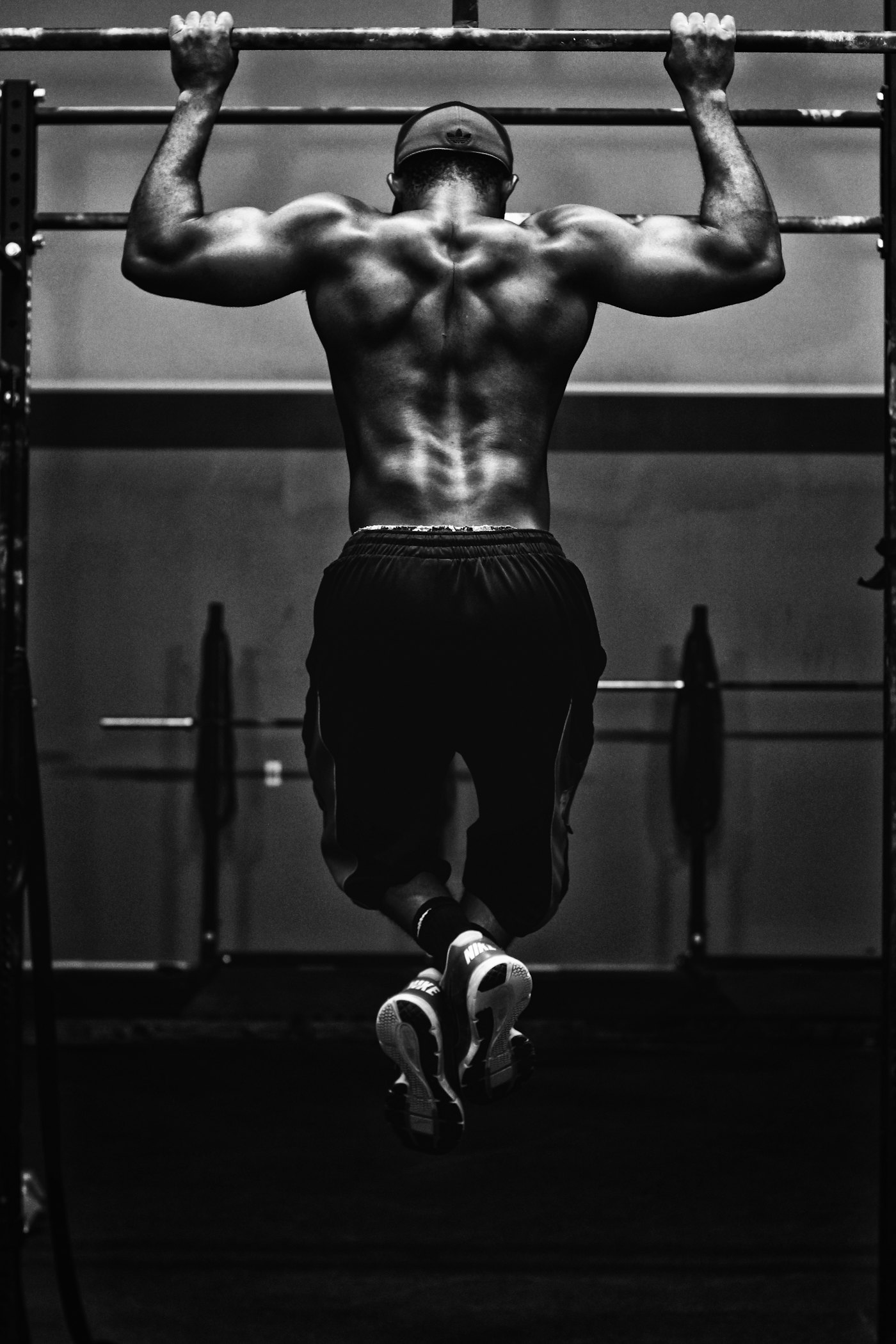 A person performing a pull-up on a rig
